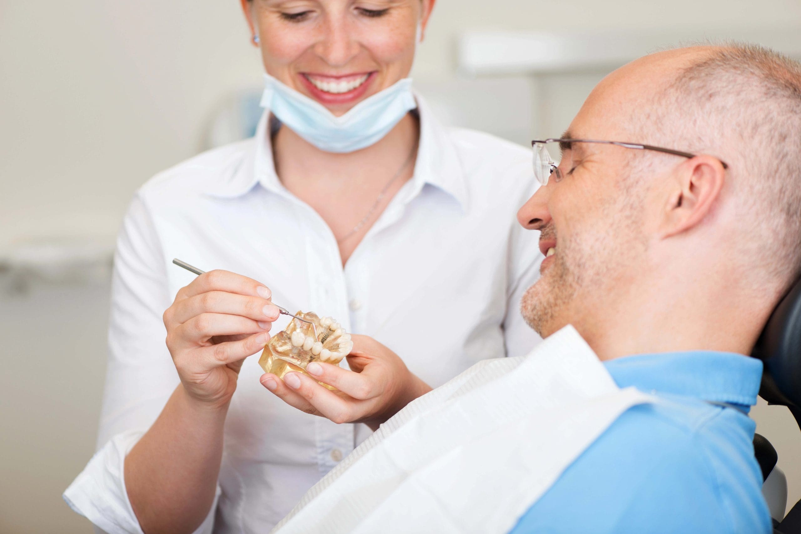 Dental Implant vs Bridge: Pros and Cons